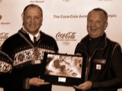 Tracey Lamb (left) and Joe Lamb accepting the "Coca-Cola Award: Live Olympic."